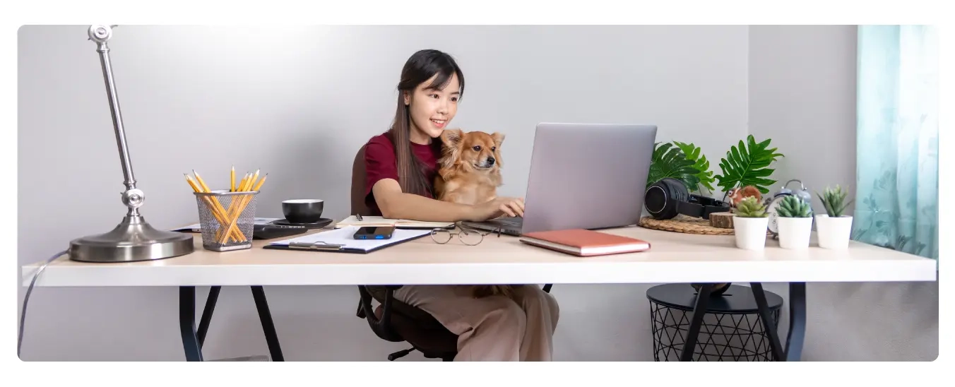 Image of a remote employee working in her home office.