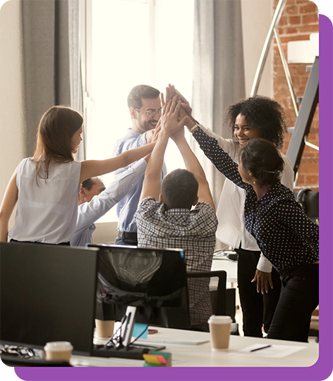 Image of a work team putting their hands together